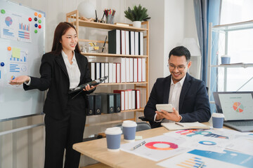 Business Presentation: A confident businesswoman delivers a presentation to a focused businessman in a modern office setting. The scene radiates professionalism and the pursuit of success.