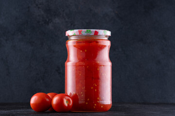 Traditional homemade canned tomatoes. Canned tomatoes prepared for winter meals