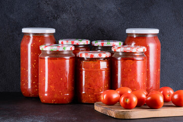 Traditional homemade canned tomatoes. Canned tomatoes prepared for winter meals