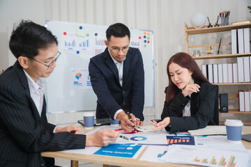 Strategic Business Meeting: Focused Teamwork in Modern Office Setting 