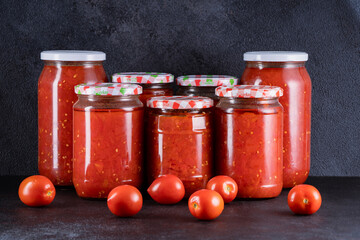 Traditional homemade canned tomatoes. Canned tomatoes prepared for winter meals