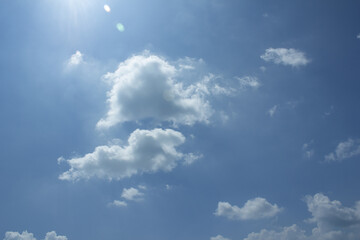 
Blue sky with puffy clouds