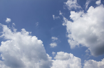 
Blue sky with puffy clouds