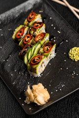 sushi food. Maki ands rolls with tuna, salmon, shrimp, crab and avocado. Top view of assorted sushi. Rainbow sushi roll, uramaki, hosomaki and nigiri.