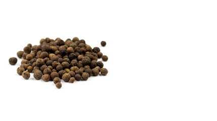 allspice peas on white background with copy space
