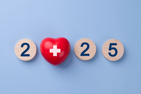 2025 New year for healthcare concept. A red heart and the numbers 2025 arranged horizontally on a light blue background. health insurance. Mental Wellness. medical. New year resolutions goal. - Powered by Adobe