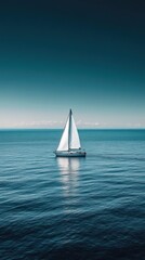 Obraz premium Solitary sailboat in endless ocean, light reflection