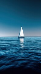 Obraz premium Isolated sailboat sails calmly across endless ocean