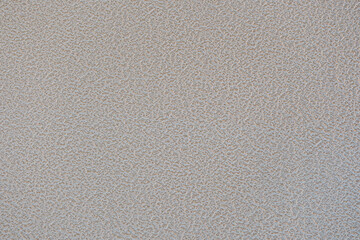 凸凹の飾りのついたコンクリートのざらざらの壁のテクスチャー背景壁紙　穴の開いたアスファルトの壁・天井