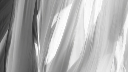 Obraz premium Abstract Black and White Waves: Fluid, glossy textures creating a dynamic visual impression for modern design use.