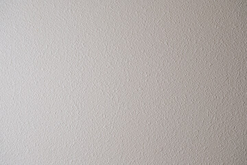 凸凹の飾りのついたコンクリートのざらざらの壁のテクスチャー背景壁紙　穴の開いたアスファルトの壁・天井