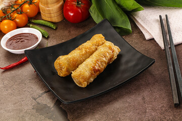 Vietnamese stuffed spring roll served sauce