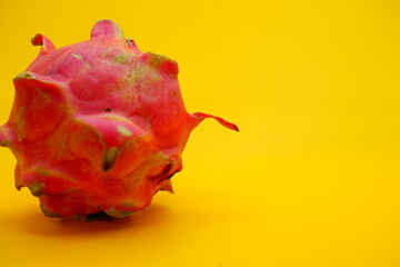 a dragon fruit isolated on yellow background