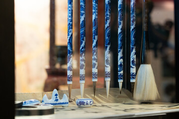 Chinese calligraphy brush set made of white and blue porcelain, displaying chinese heritage
