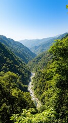 Obraz premium Breathtaking View of a Serene River Valley Surrounded by Lush Green Mountains