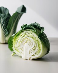 Fototapeta premium Freshly Cut Green Cabbage on a Surface Nutritional Advantages of this Wholesome Vegetable Salad.