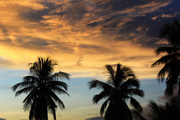 sunset with clouds over  the village in india
