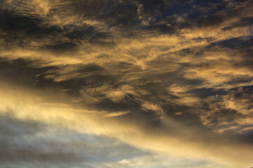 sunset with clouds over  the village in india