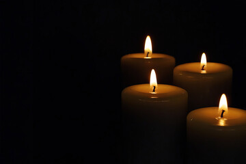 Candle flames give light in the darkness, concept of hope.