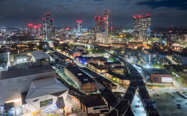 Manchester city centre at night, aerial view from the west.  Iconic landmarks illuminate the skyline of Manchester, england with modern tower blocks and city centre development