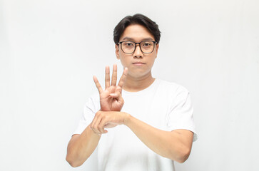 asian young students happily using sign language isolated against white background. Asian man...
