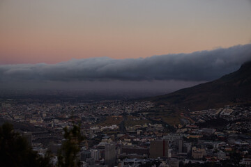 Fototapeta premium Outdoor, evening and environment with aerial by city for holiday, scenery and travel destination. Sunset, sky and with building by nature for vacation, adventure and view of location infrastructure