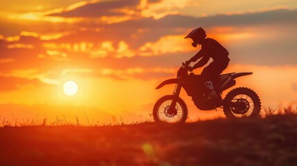Fototapeta premium Silhouette of a person riding a motorcycle during sunset, capturing the essence of extreme sports and the thrill of dirt biking in a natural setting