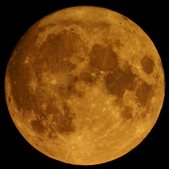 A full moon shines brightly in the night sky
