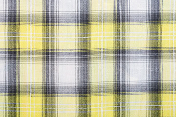 Yellow checkered fabric a background or texture