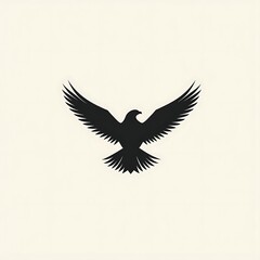 Fototapeta premium Simple silhouette of an eagle with wings spread wide.