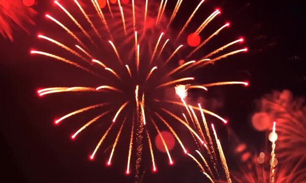 2025 New Year's Eve Party video. Red fireworks dark blue bokeh background video. Copy paste area for text