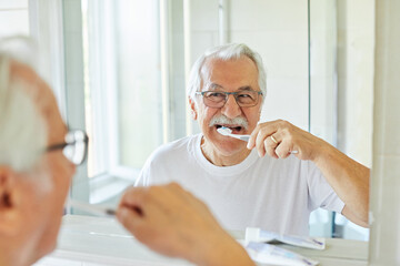 man tooth bathroom toothbrush hygiene senior morning routine brushing toothpaste care dental...