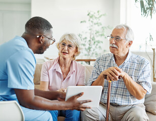 nurse doctor senior couple care caregiver help assistence retirement home nursing elderly man woman...