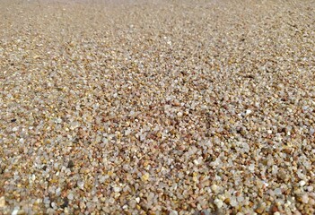 Close-up of sand on the seashore, grains of sand - macro photography 