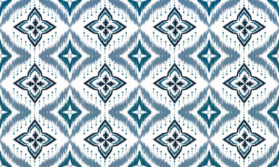 A traditional Ikat pattern with a repeating geometric design. Ikat is a textile dyeing technique that creates a blurred effect.