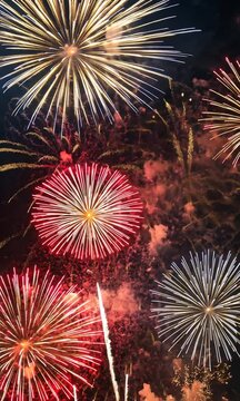2025 New Year's Eve Party Celebration vertical video. Colorful fireworks dark blue bokeh vertical video. Copy paste area for text