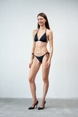 Summer, body and portrait of woman in studio with confidence for fashion and swimwear. Model girl,...