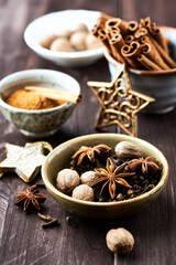 Star anise with cinnamon. Christmas spices on rustic wooden background. Close up.	