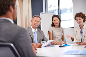 Meeting, documents and business people in discussion in office for planning, teamwork or collaboration. Corporate, professional and men and women with paperwork for feedback, review or finance report