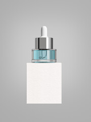 Small dropper bottle and paper box packaging mockup, aluminum pipette dropper cap and clear glass skincare dropper bottle standing on empty white box, close up shot of liquid cosmetic container