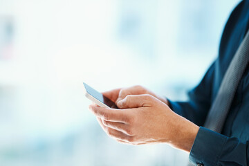 App, hands and phone with business person in office for communication, networking or typing closeup. Internet, mobile and social media with corporate employee in workplace for information search