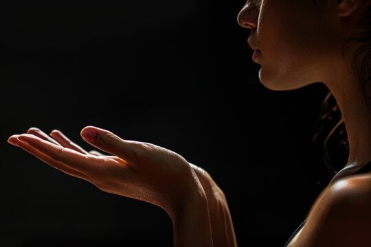 Dancers hands performing ballet on dark stage during practice session, highlighting the artistry and technique of movement in a dance class