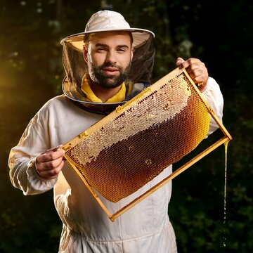 beekeeper with bees in his apiary