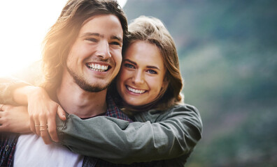 Couple, happy and portrait with hug in nature for outdoor adventure, romantic or weekend vacation. Man, woman and smile with love in sunshine for marriage connection, bonding or holiday trip together