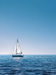 Fototapeta premium Sailboat Gliding Across Open Ocean Under Clear Blue Sky Capturing Freedom Adventure