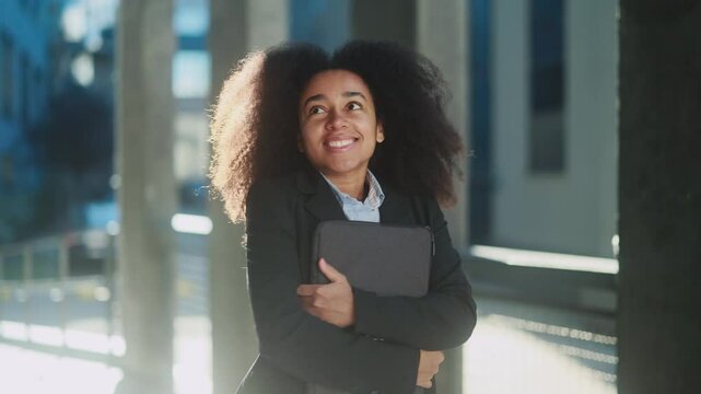 Inspired african american female take deep breath before the first day at new job work important interview or university outdoors Pretty young woman dares to take an important step at city street