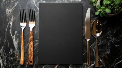 A minimalist dining setup featuring utensils and a blank menu on a marble table.