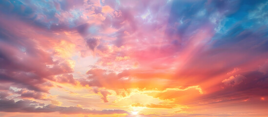 Obraz premium Colorful sky with a beautiful sunset, light rays shining through the clouds