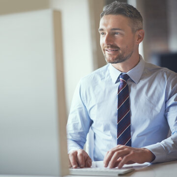 Thinking, typing and man with computer, smile and ideas for legal report, investigation and disputes. Web, planning and person in office, ombudsman and reading of information, research and happy