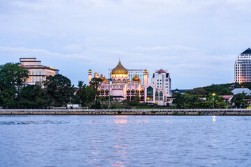 Pink Masjid Bahagian Kuching (State Mosque) or Kampung Musjid (Village Mosque or City Mosque) as seen from Kuching River on cruise boat. Built 1847.
